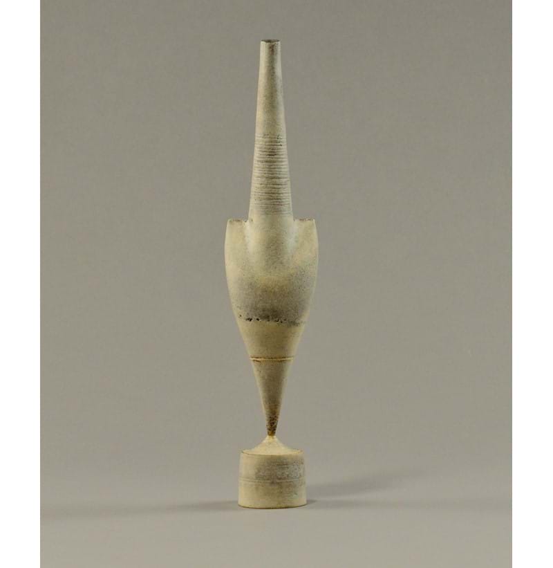 HANS COPER (1920-1981); a stoneware cycladic arrow form pinned to drum base.