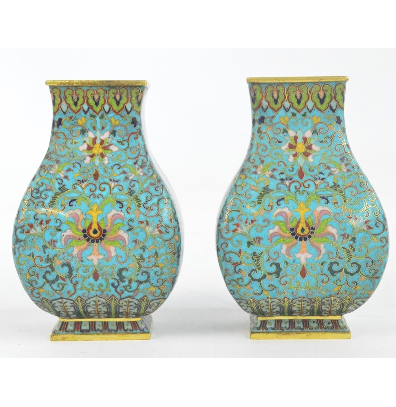 A pair of 19th century Chinese cloisonné enamel decorated brass vases of rectangular baluster form.