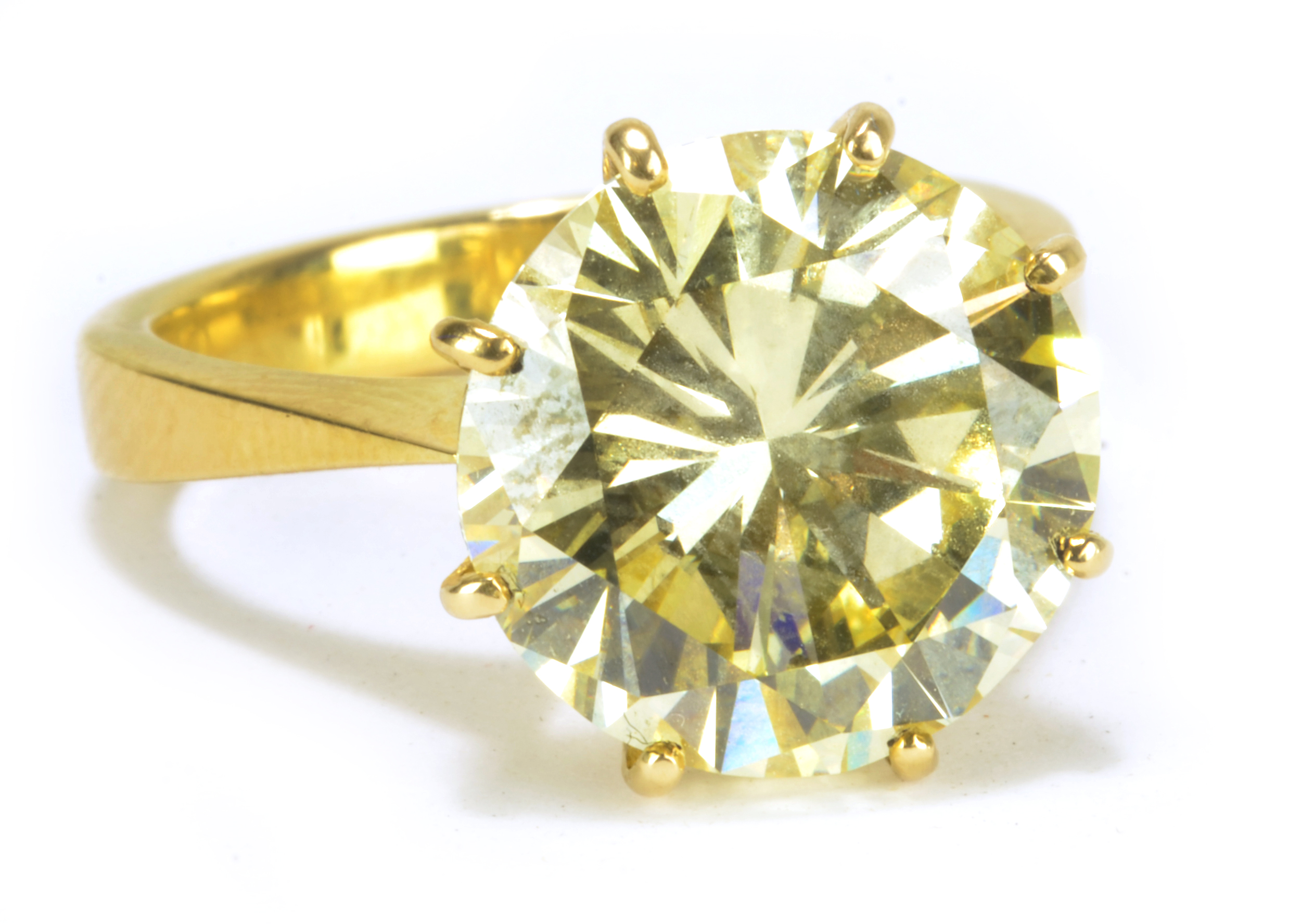 An impressive 18ct yellow gold and fancy light yellow brilliant cut diamond solitaire ring.