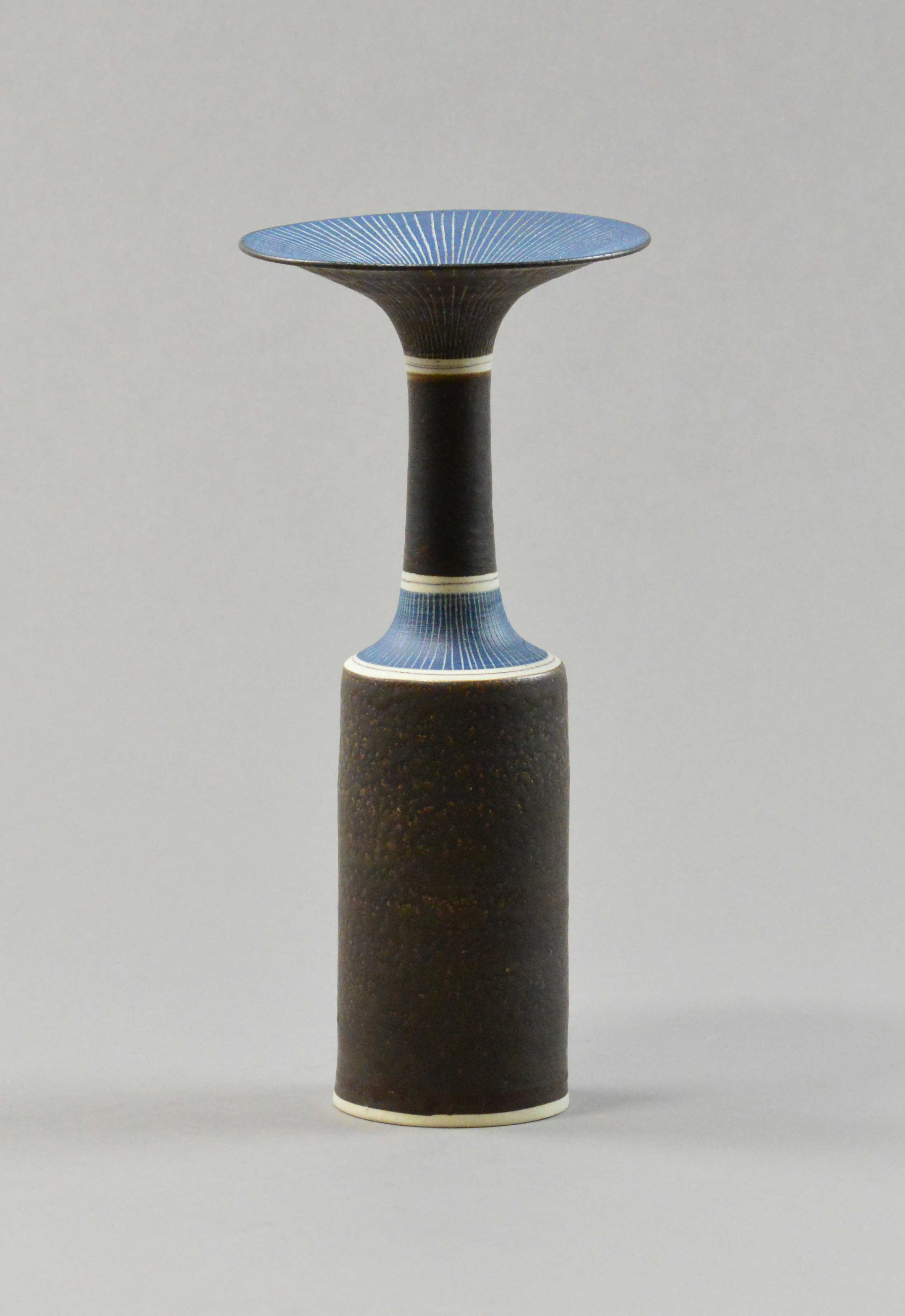 LUCIE RIE (1902-1995); a porcelain vase, straight sided with slender neck and flared rim. 