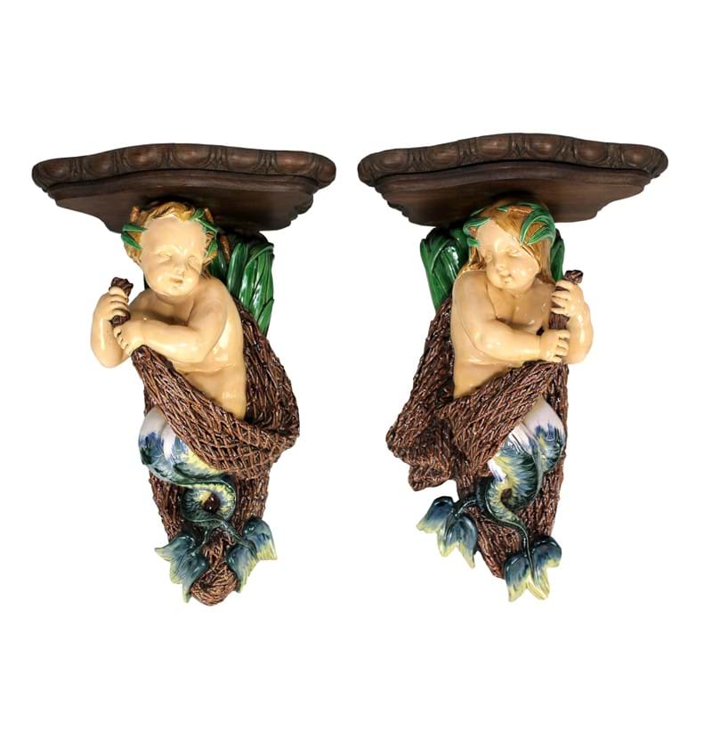 An exceptionally rare pair of Minton majolica wall brackets.
