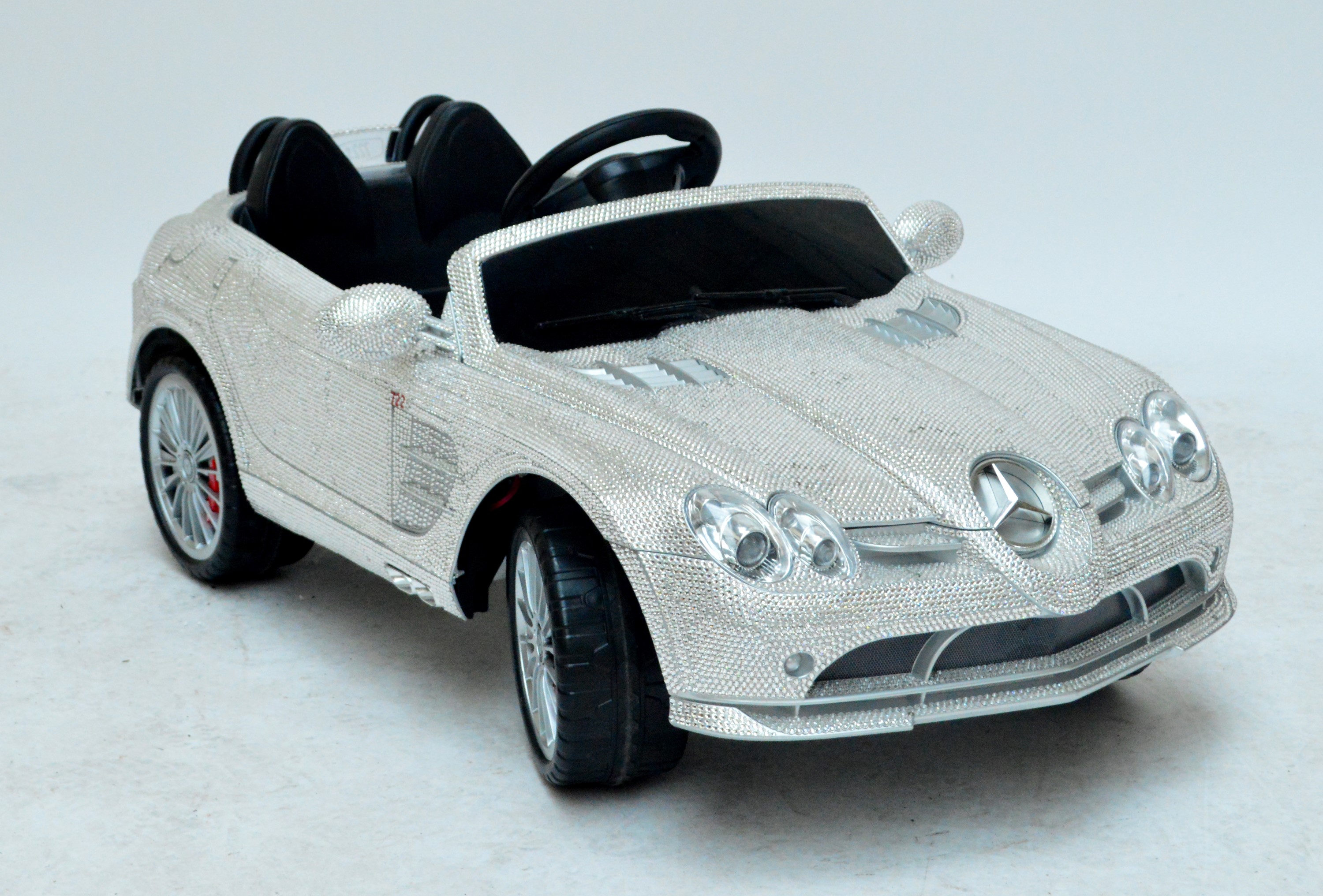 A unique child’s Mercedes SLR 7225 toy car set with Swarovski crystals.