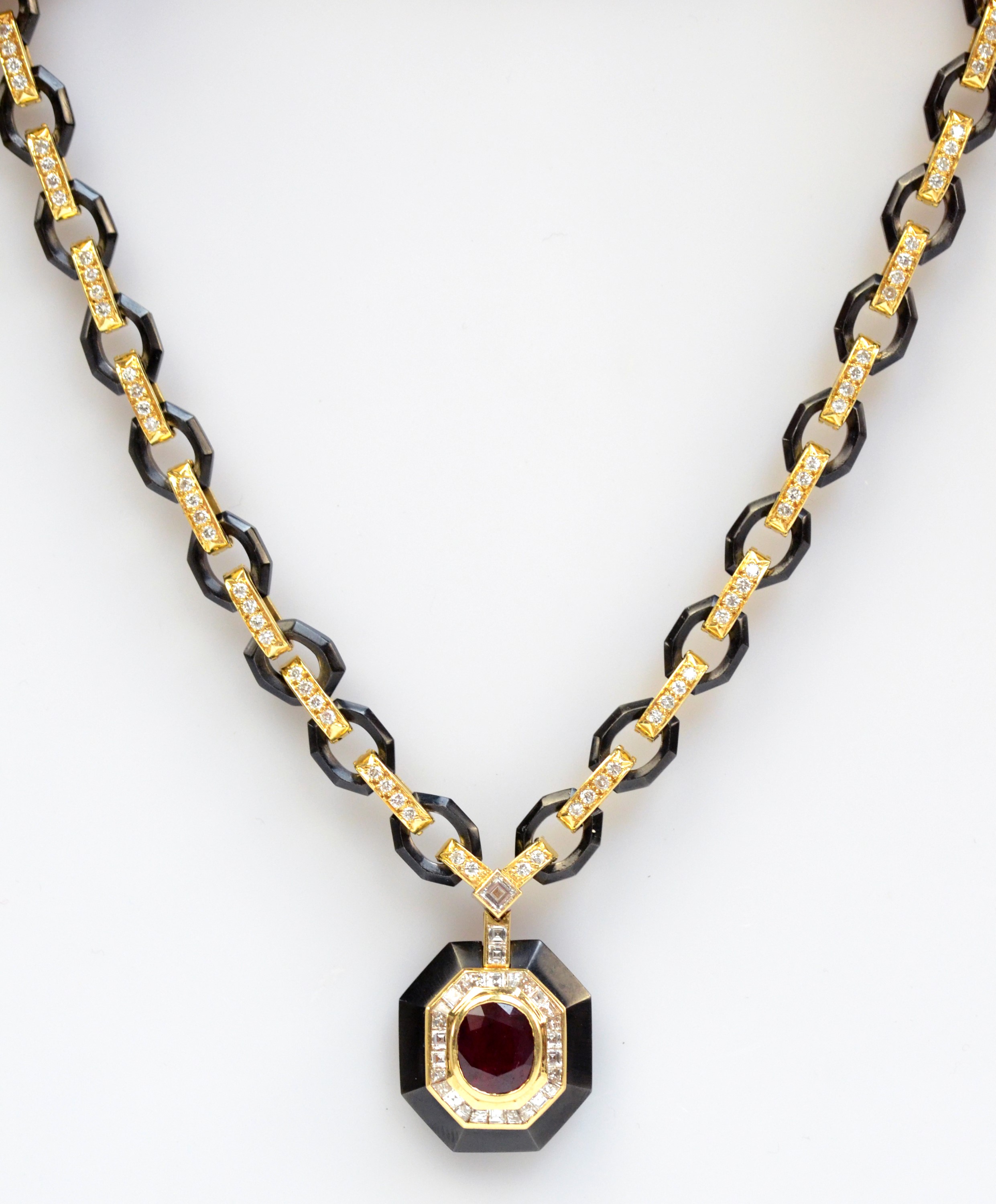 VAN CLEEF & ARPELS; an 18ct gold 'black platinum' ruby and diamond necklace.
