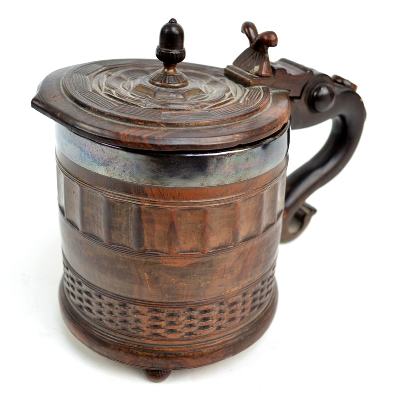 A rare 17th century lignum vitae York tankard.