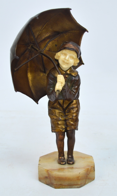 DEMETRE CHIPARUS (1886-1947); an Art Deco cold painted bronze and ivory figure of a young girl carrying an umbrella.