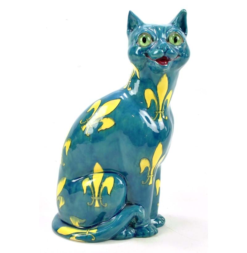 WILEMAN & CO; a rare Foley 'Intarsio' model of a small cat decorated with yellow fleur-de-lis on a blue ground.