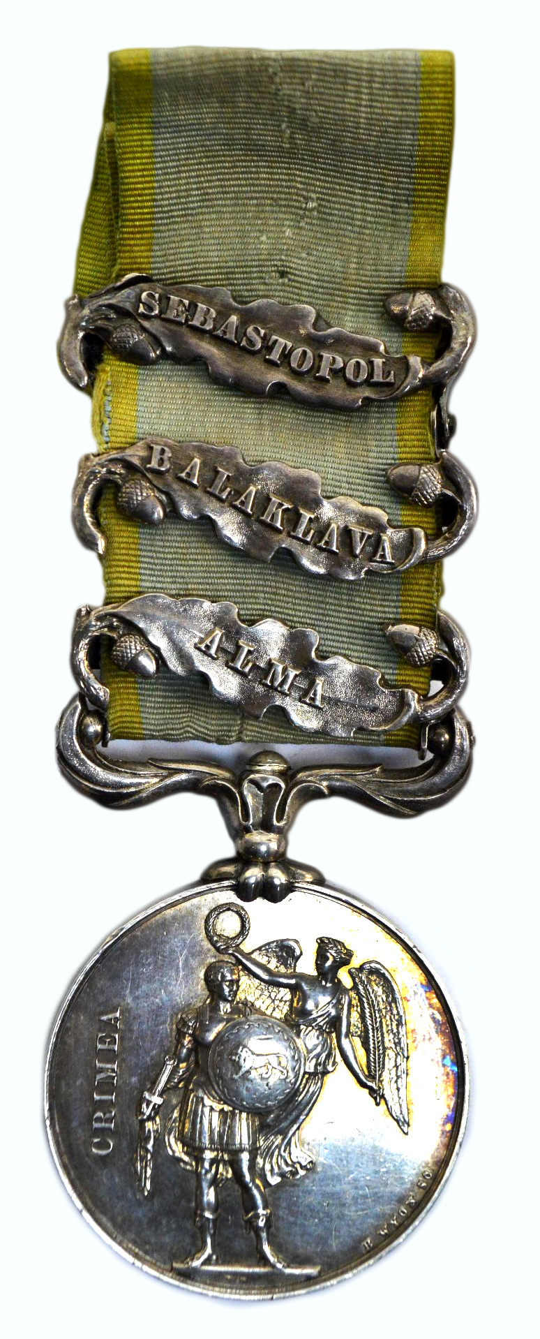A Crimea medal with three oak and acorn bars.