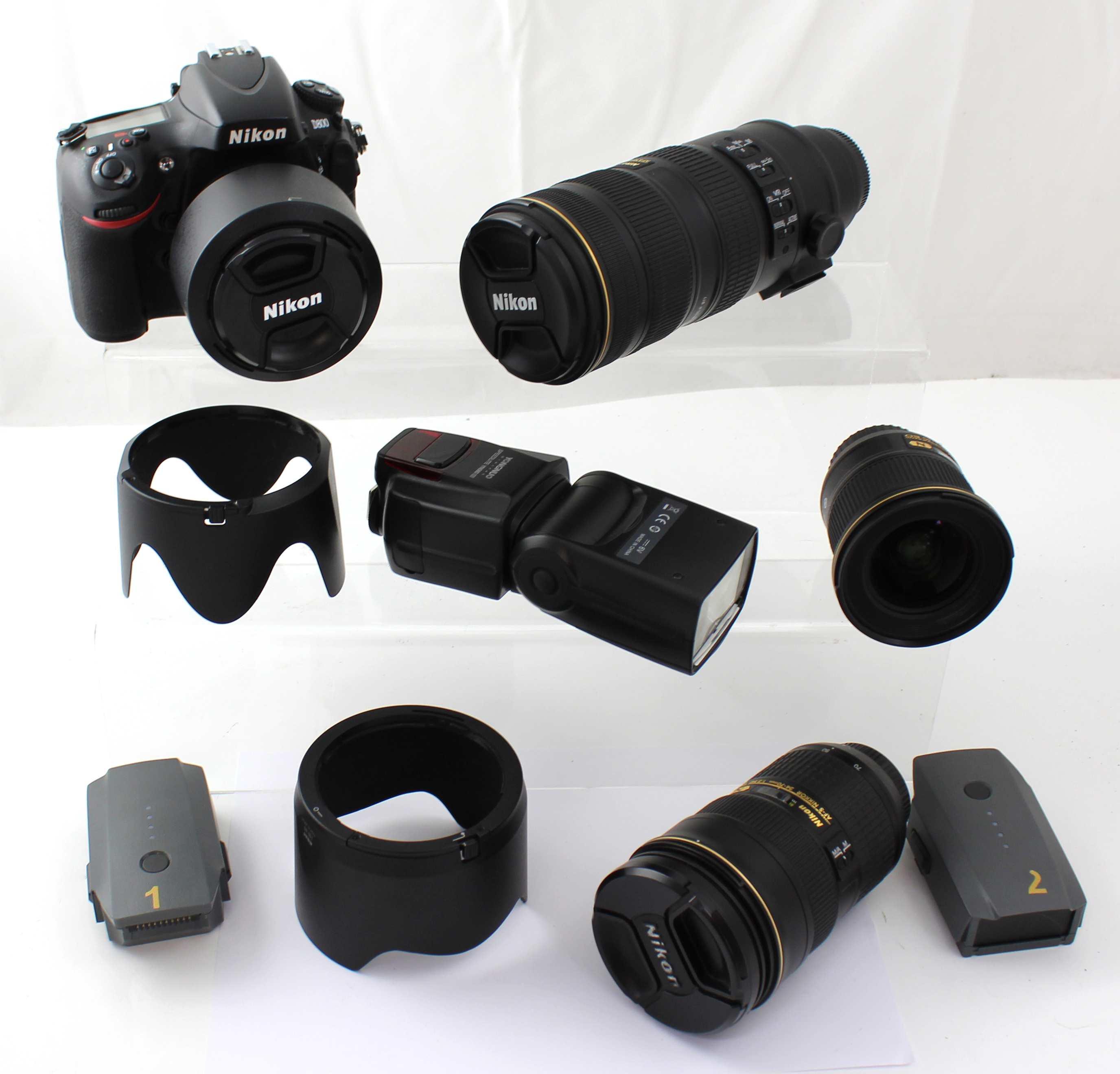 A camera bag containing a Nikon D800 camera, a Nikon AF/S Nikkor 24-70mm lens, a Nikon Nanocrystal Coat SWRFED Aspeherical 077 lens no.251901, a Nikon AF-S Nikkor 70-200mm 1:2.8g II ED lens and a Speedlite flash YN560 III.