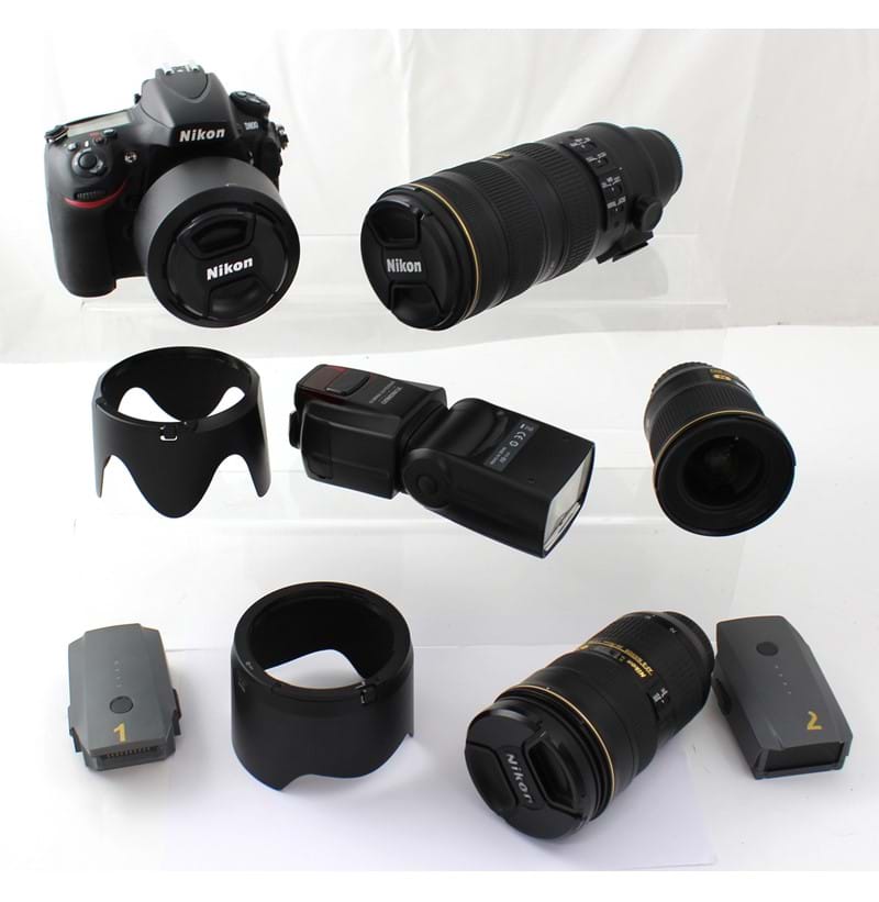 A camera bag containing a Nikon D800 camera, a Nikon AF/S Nikkor 24-70mm lens, a Nikon Nanocrystal Coat SWRFED Aspeherical 077 lens no.251901, a Nikon AF-S Nikkor 70-200mm 1:2.8g II ED lens and a Speedlite flash YN560 III.