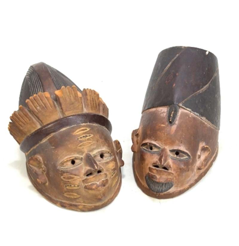 A pair of African wooden tribal masks.